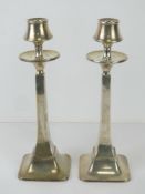 A pair of Art Deco HM silver candlesticks made by W G Sothers Ltd, hallmarked Birmingham 1923,
