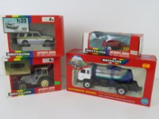 Four Britains vehicles in boxes; Police Land Rover Discovery, Milk Marque Tanker, Mini Trailer,