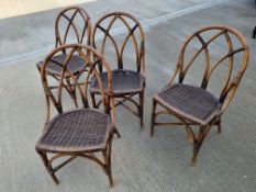 A set of four mid century Angraves of Leicester Invincible wicker / cane chairs.