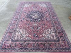 A 100% wool rug in red and navy ground having hunting pattern, approx 296 x 198cm.