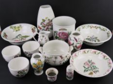 A quantity of Portmerion in Botanic Garden pattern including fruit bowls, vases, jug, planter,