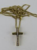 A yellow metal crucifix on 9ct gold chain, 2.2g.