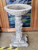A pre-cast birdbath having ivy and mouse decoration to the column, 73cm high.