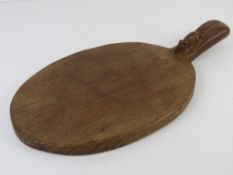 A Robert Mouseman Thompson oak cheeseboard, carved with signature mouse, 39 x 20.