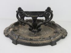 A cast iron boot scraper 36cm wide