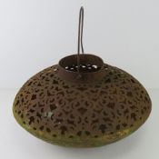 A contemporary pierced metal fire pit, approx 50cm dia.