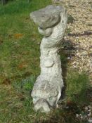 A pre-cast plinth in the form of a fish, 44cm high.