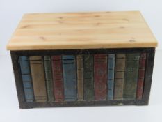 A contemporary pine lidded storage box having painted bookcase design to front, 55 x 37.5 x 29.5cm.