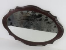 A hanging wall mirror 56 x 37cm overall