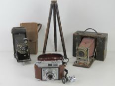 Three vintage cameras; Kodak No1 Diodak, Kodak Retinette and Kodak Junior Six-16.