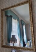 A contemporary gilded framed bevelled edge mirror, 130 x 100cm.