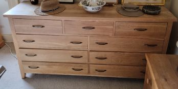An oak chest of three short drawers over three pairs of long drawers, 174 x 46 x 88cm.