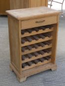 A pine wine rack having single drawer over, 60 x 37 x 88.5cm.