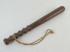 An early 20th century oak truncheon measuring approx 39cm in length.
