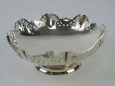 A HM silver bonbon dish having pierced decorative border and raised over single foot,