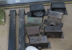 A quantity of cast iron rain hoppers including two lengths of pipe.