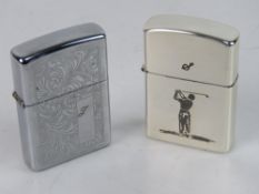 A Zippo lighter, together with a GOlf themed lighter by Hadson. Two items.