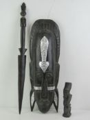 A contemporary ebonised wall mask from the Ubud region of Bali, approx 51cm in length,