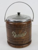A vintage oak biscuit barrel.