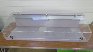 A perspex display cabinet, light fitting for rewiring.