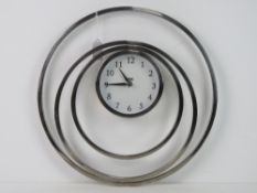 A contemporary wall clock by Next.