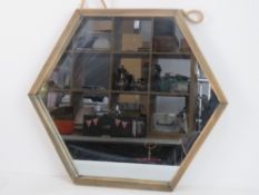 A contemporary Hexagonal wall mirror.