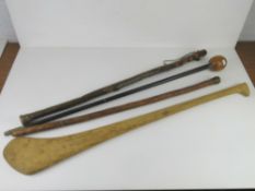 A quantity of assorted walking sticks, knobkerry, sports club/stick?. Four items.
