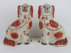 A pair of Staffordshire Spaniel figurines, a/f.
