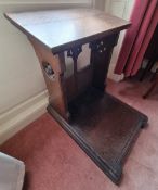 A late Victorian oak prayer desk having quatreform pierced carving,