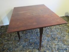 A 19thC mahogany drop leaf dining table with pull out legs, 106 x 138 (extended) x 70cm.