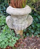 A pre-cast stone urn of Classical style, 25