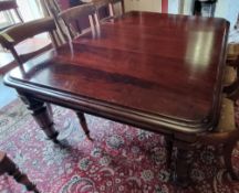 A Victorian pull out mahogany dining table with three leaves to seat 12, chairs not included,