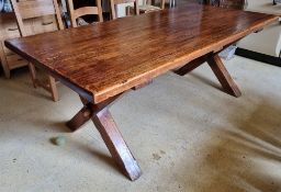 A 20th century oak kitchen table raised over X shaped supports, 6ft 6