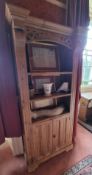 A contemporary pine bookcase with cupboard under, 90 x 40 x 190cm.