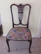 A single mahogany Edwardian side chair having needlepoint seat, and decorative pierced splats.