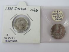 A 1787 George III six pence marked as A.