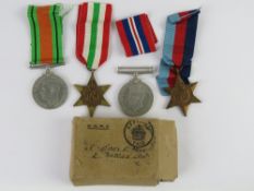 Four WWII medals with ribbons and origin