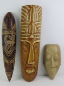 A Tiki hand carved and stained wall mask