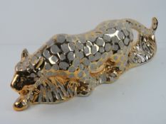 A gold and silver painted jaguar.