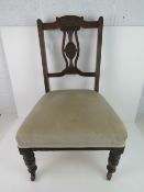 A single Victorian low fireside chair ra