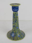A ceramic candlestick having oriental st
