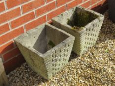 A pair of pre-cast planters having brickwork pattern upon, each 30cm wide x 29cm high.