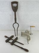A vintage table top meat mincer together with a wooden clamp and an antique garden implement 3