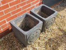 A pair of dark grey painted planters having galleon type masted sailing ships upon,