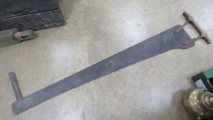 A vintage two person saw measuring 150cm in length