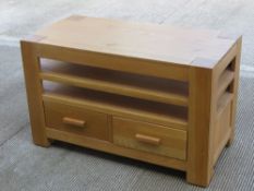 A contemporary oak table having two drawers, 50 x 100 x 60.5cm.