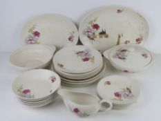 A J&G Meakin part dinner service decorated with pink floral design.
