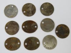 Ten WWII British issued dog tags.