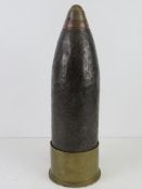 An inert WWI British 4.5cm Howitzer shell, casing, fuze and primer dated 1917, Approx. 42cm tall.