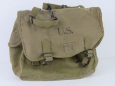 A WWII US bag with yoke, dated 1944 inside, yoke dated July 1941 .